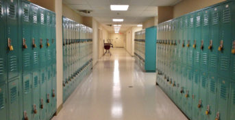 school hallway with lockers on either side