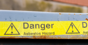 danger asbestos hazard caution tape outside