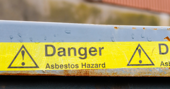 danger asbestos hazard caution tape outside