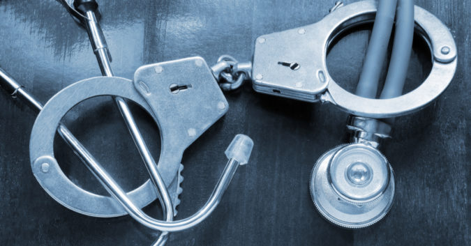 handcuffs around a stethoscope