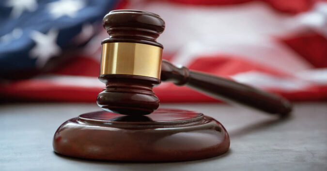 Gavel rests in front of an American flag