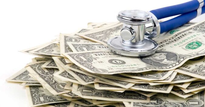 Money below a stethoscope