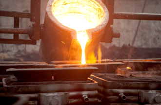 lead smelter pouring hot liquid lead