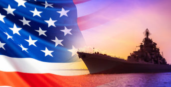 an American flag and a U.S. Navy ship