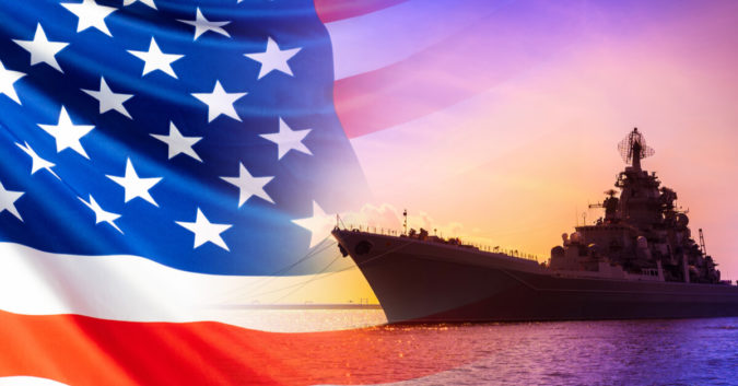 an American flag and a U.S. Navy ship