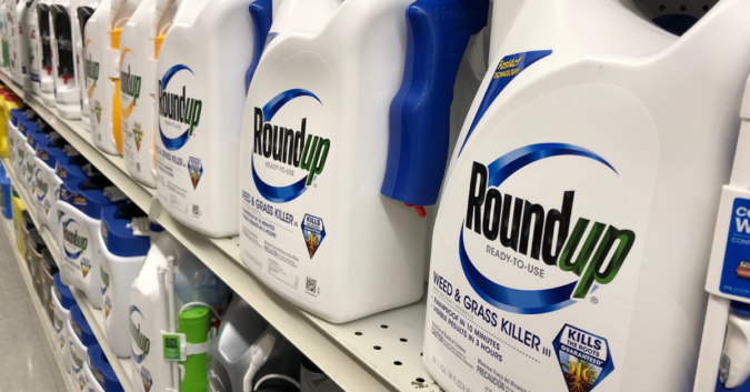 bottles of Roundup weed killer on a shelf