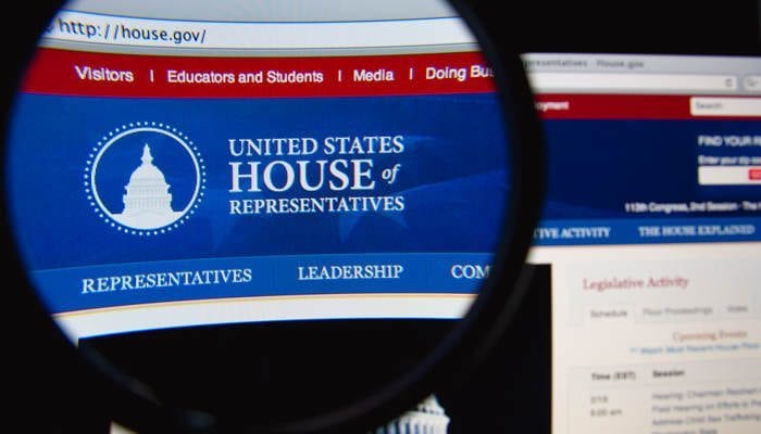 LISBON, PORTUGAL - February 24, 2015: Photo of United States House of Representatives page on a monitor screen through a magnifying glass
