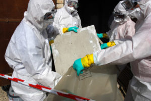 Staff removing materials containing asbestos