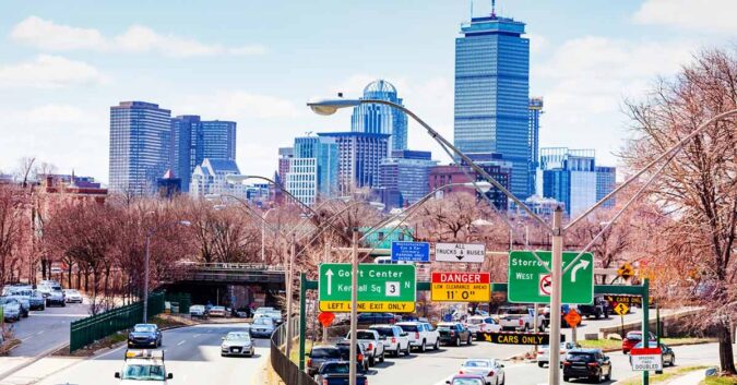 Drivers in the city of Boston, including a sign for the accident-prone Storrow Drive