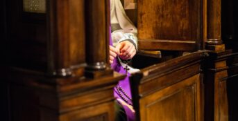 A priest at confession