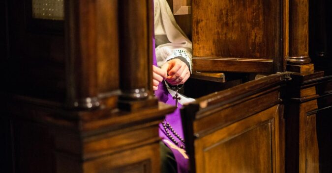 A priest at confession