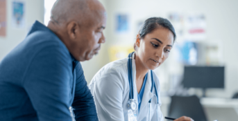 Doctor talking with patient