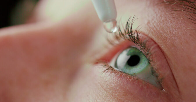 person applies contaminated eye drops