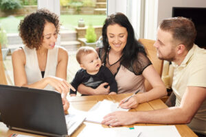 A couple and their young child meet with a lawyer