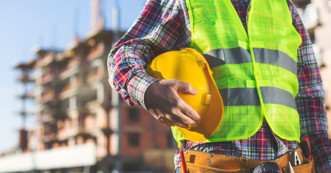 Construction worker holding his hard hat