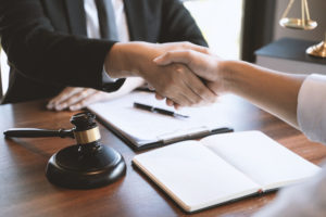 Lawyer and client shaking hands