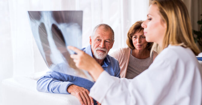 A couple looks at a lung X-ray
