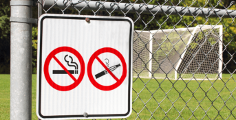 No vaping or smoking signs on fence