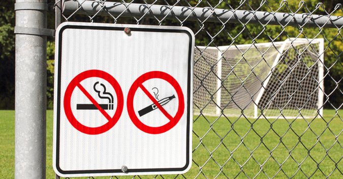 No vaping or smoking signs on fence