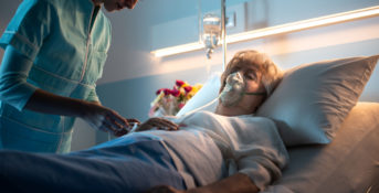 elderly woman in hospital bed