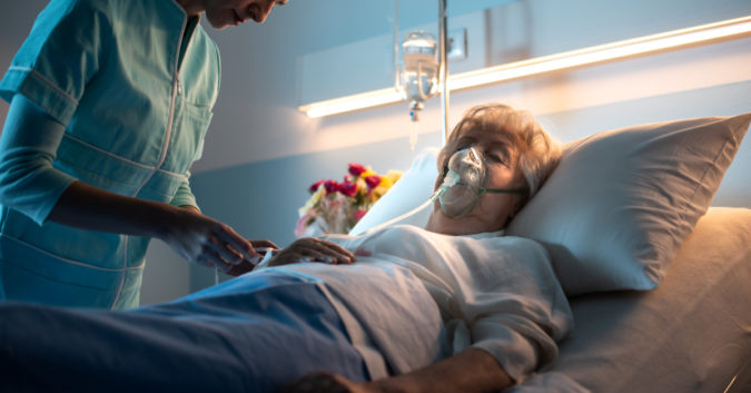 elderly woman in hospital bed