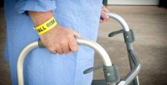 Nursing home patient with a "fall risk" bracelet