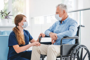 Man in wheelchair with nurse