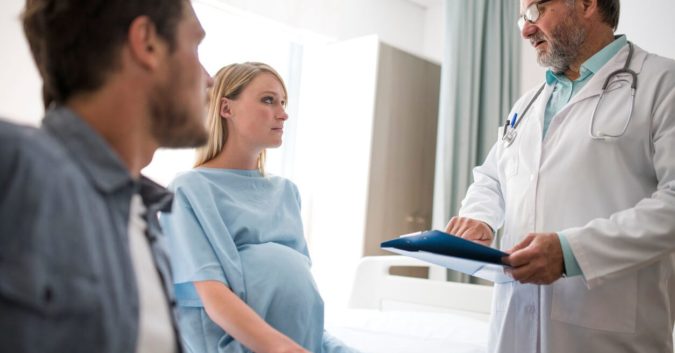 pregnant woman at doctors office