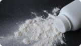 A spilled bottle of talc-based baby powder