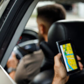 A passenger uses a rideshare app