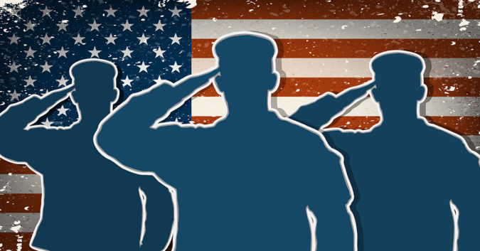 Soldiers Saluting in front of American flag