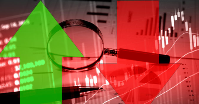 stock image of bar graphs, arrows, and magnifying glass