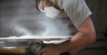 Worker exposed to silica dust while cutting stone countertop