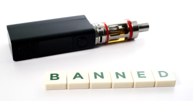e-cigarette with tiles that spell out "banned"