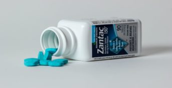 bottle of zantac pills laying on its side
